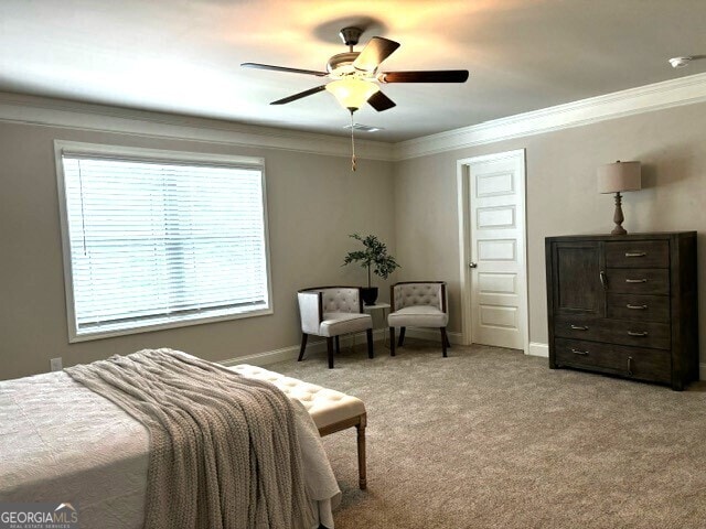 carpeted bedroom with ceiling fan, ornamental molding, and multiple windows