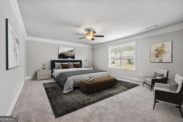 bedroom featuring ornamental molding, ceiling fan, and carpet