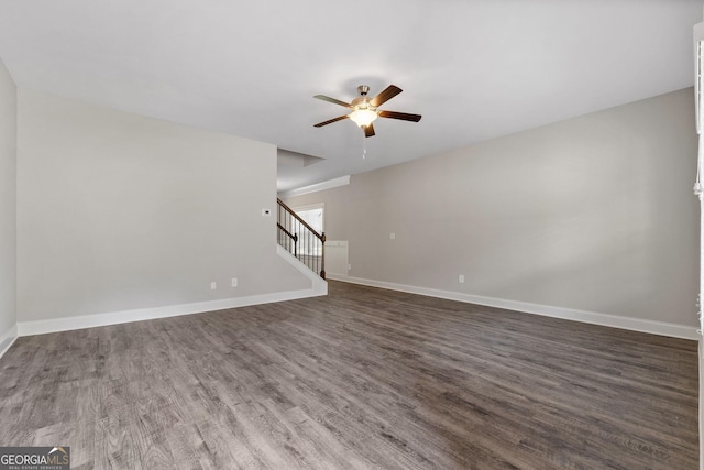 unfurnished living room with ceiling fan and dark hardwood / wood-style floors