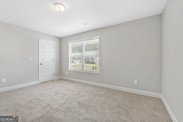 unfurnished room featuring carpet flooring