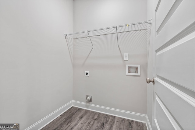 laundry room with hookup for a washing machine, hookup for an electric dryer, and dark hardwood / wood-style flooring