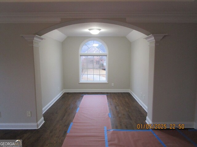 hallway featuring crown molding and dark hardwood / wood-style floors