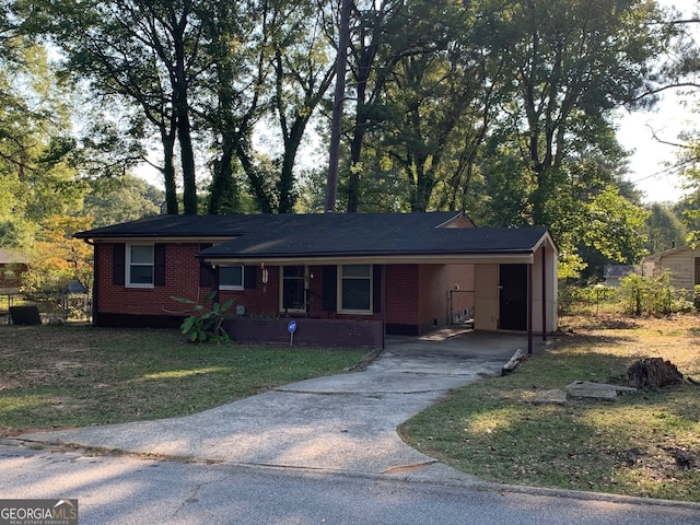 ranch-style house with a carport and a front yard