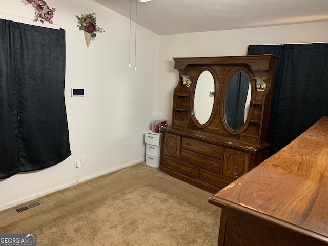 bedroom with light colored carpet