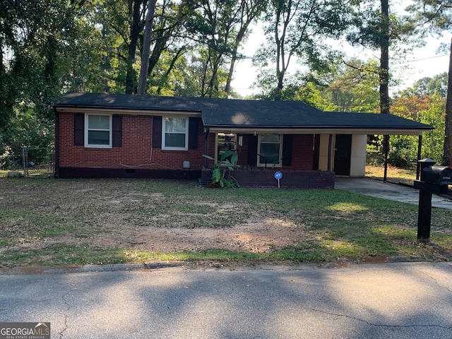 single story home featuring a carport