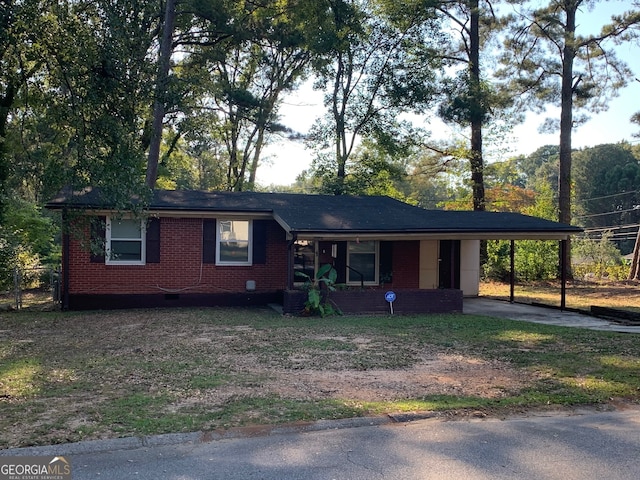 ranch-style house with a carport