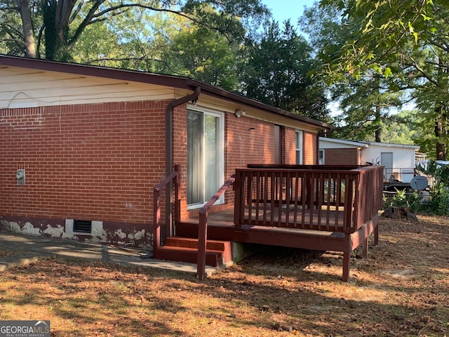 exterior space featuring a wooden deck