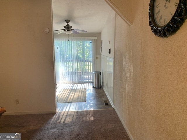 corridor with dark tile patterned floors