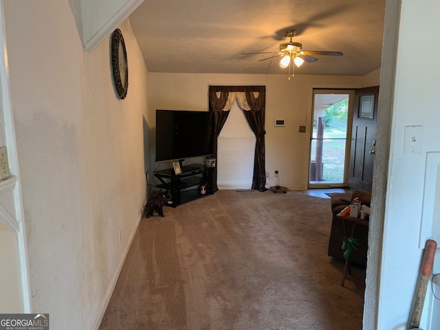 living room with carpet flooring and ceiling fan