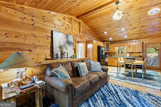 living room featuring light wood-type flooring, lofted ceiling with beams, wood walls, and wooden ceiling