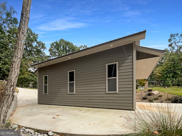 view of side of home featuring a patio