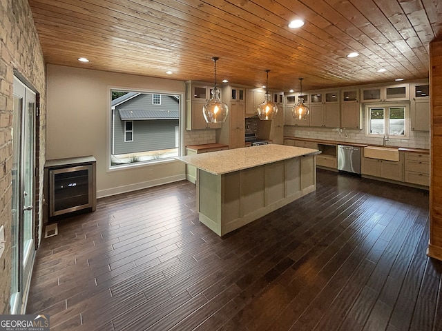 kitchen featuring pendant lighting, dark hardwood / wood-style floors, a kitchen island, backsplash, and appliances with stainless steel finishes