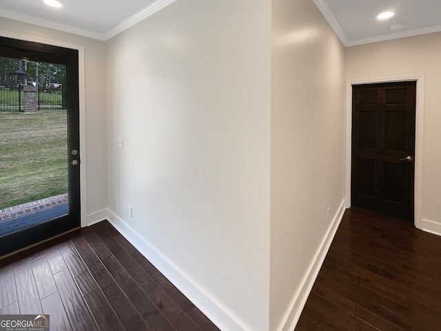 entryway with crown molding and dark hardwood / wood-style flooring