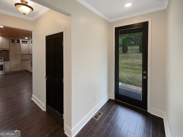 foyer entrance featuring dark hardwood / wood-style floors and crown molding