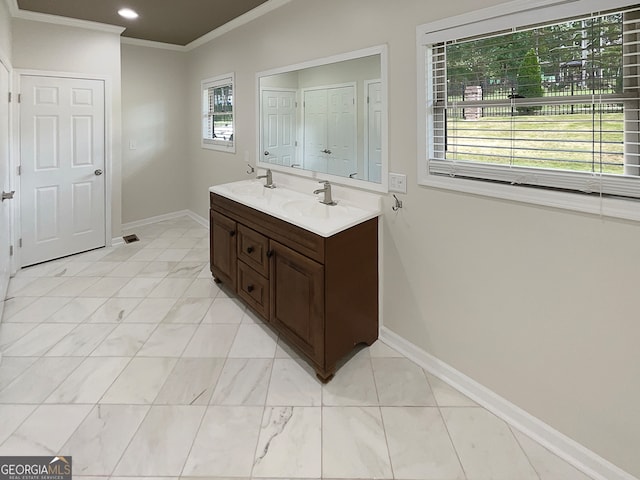 bathroom featuring vanity and crown molding