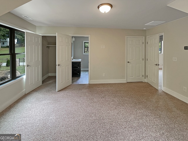 unfurnished bedroom with light carpet