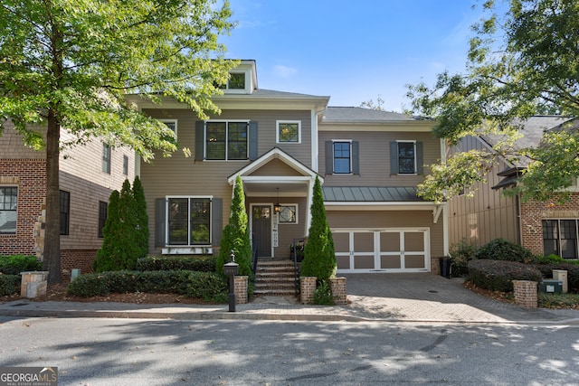 view of front of property with a garage