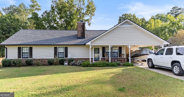 ranch-style house with a front yard and covered porch