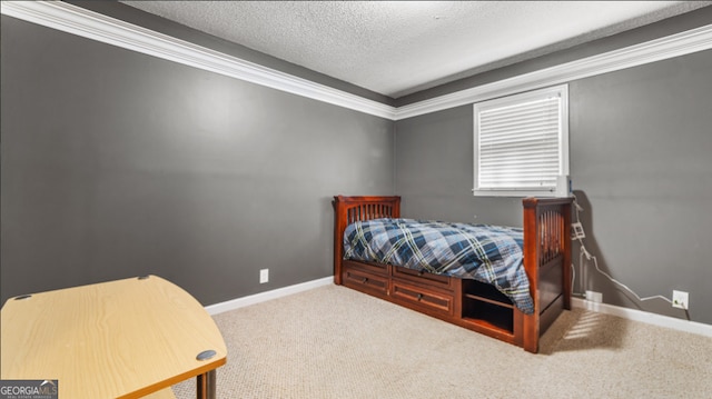 carpeted bedroom with a textured ceiling and ornamental molding