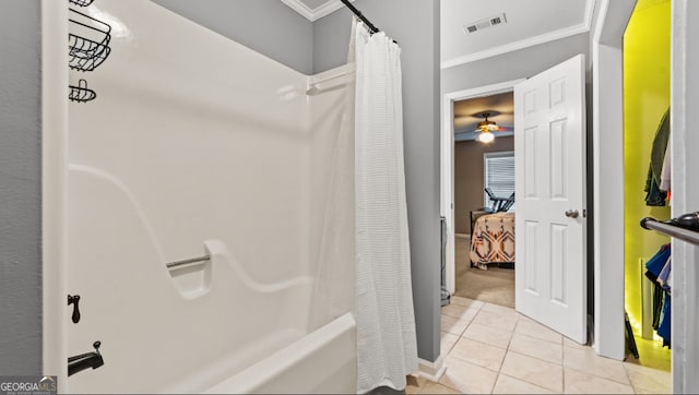 bathroom with ceiling fan, ornamental molding, tile patterned flooring, and shower / tub combo with curtain