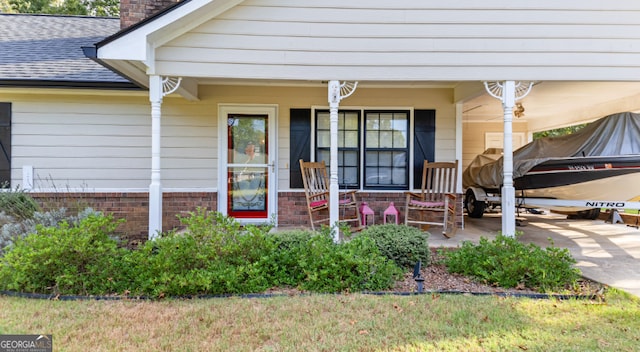 doorway to property featuring covered porch