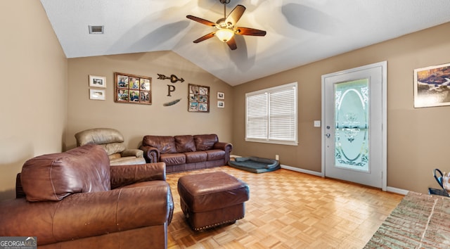 living room featuring lofted ceiling, ceiling fan, and light parquet flooring