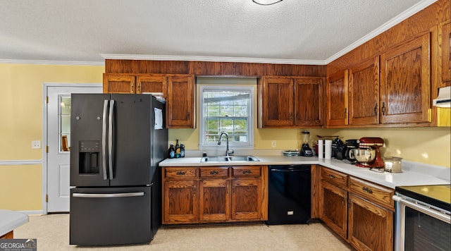 kitchen with a textured ceiling, appliances with stainless steel finishes, crown molding, and sink