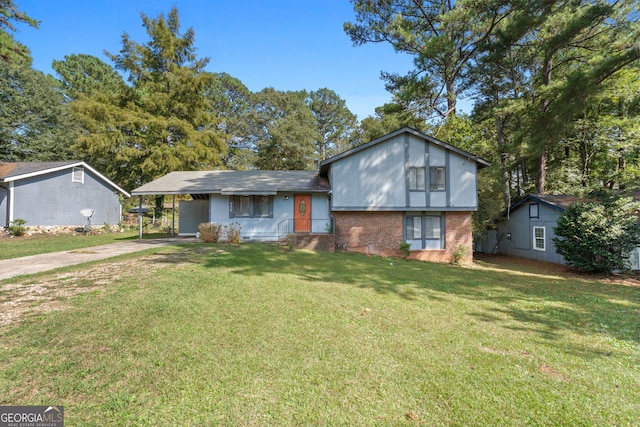 view of front facade with a front yard and a carport