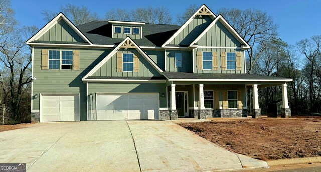 craftsman-style house featuring a garage and a porch