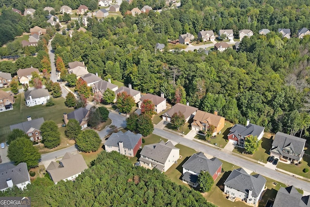 bird's eye view with a residential view and a view of trees