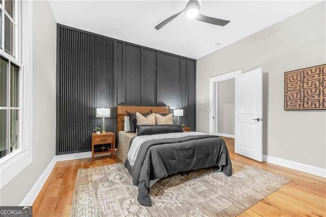 bedroom featuring ceiling fan and light hardwood / wood-style floors