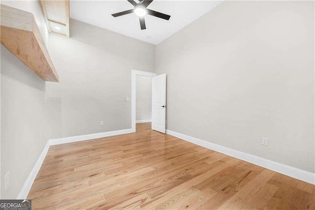 spare room featuring ceiling fan and light hardwood / wood-style floors