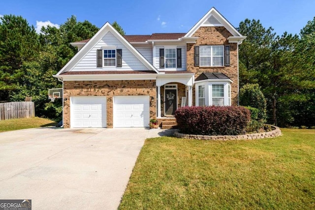 view of front of property with a front lawn and a garage