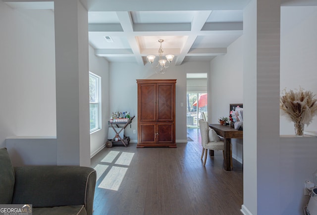 entryway with an inviting chandelier, beamed ceiling, coffered ceiling, and dark hardwood / wood-style flooring