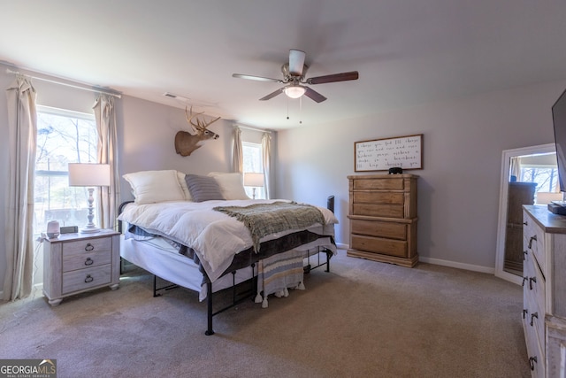 carpeted bedroom featuring ceiling fan