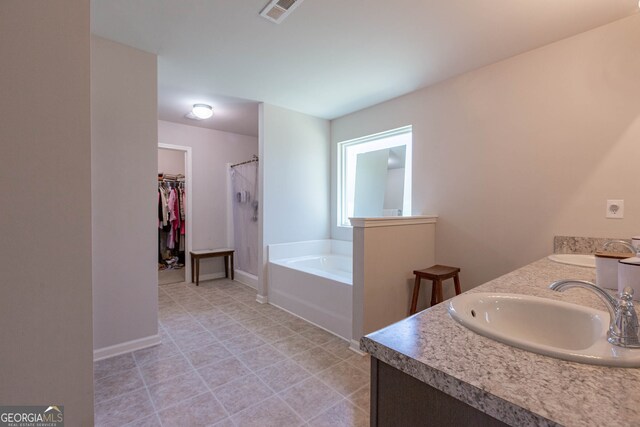 bathroom featuring vanity and a bathtub