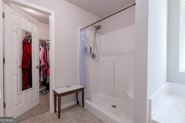 bathroom featuring independent shower and bath and tile patterned floors