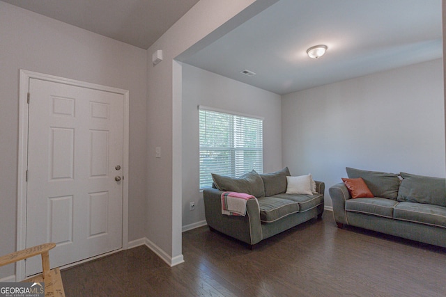 living room featuring dark hardwood / wood-style floors