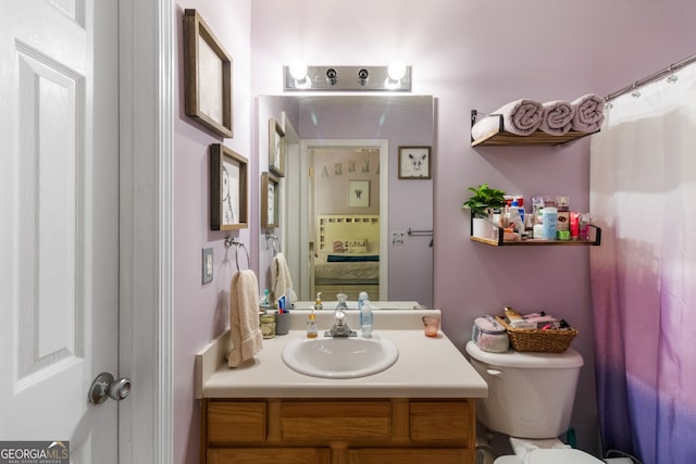 bathroom with vanity and toilet