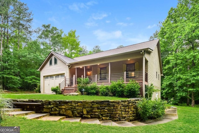 ranch-style home with a front lawn, a porch, and a garage