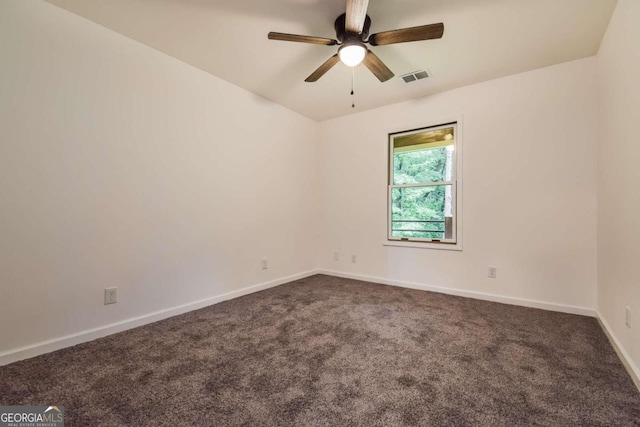 carpeted spare room with ceiling fan