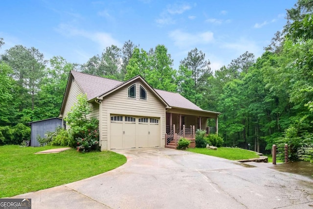 view of front of home with a garage, a porch, and a front lawn