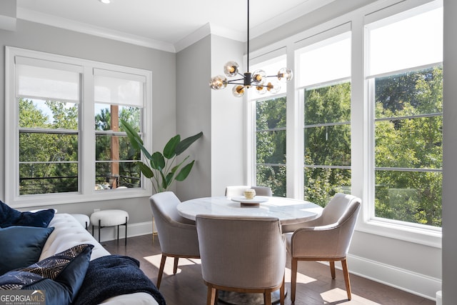 dining area featuring an inviting chandelier, crown molding, and dark hardwood / wood-style flooring