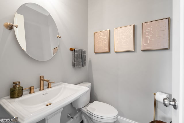 bathroom with sink and toilet