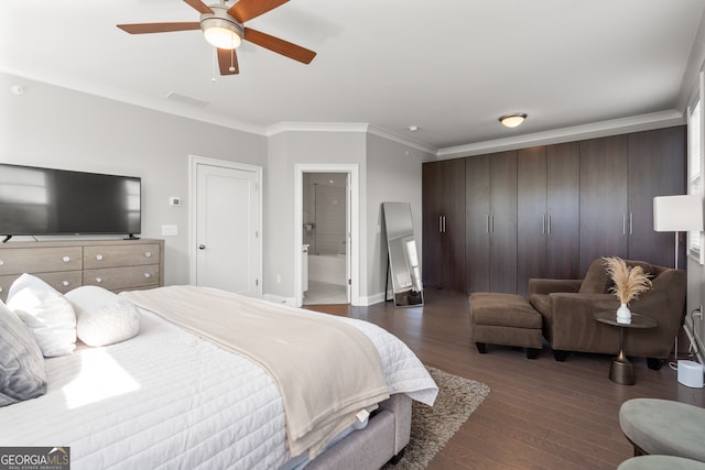 bedroom featuring ceiling fan, ensuite bath, dark wood-type flooring, and ornamental molding