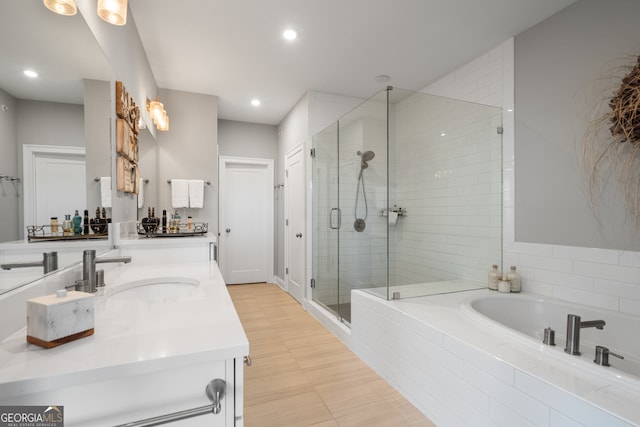 bathroom with separate shower and tub and vanity