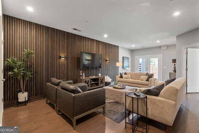 living room with hardwood / wood-style flooring and french doors