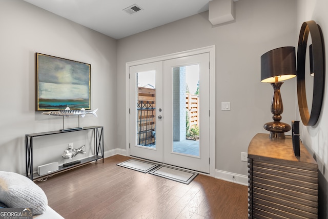 entryway featuring french doors and dark hardwood / wood-style flooring