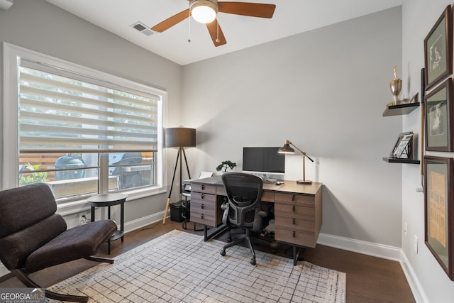 home office with light wood-type flooring and ceiling fan