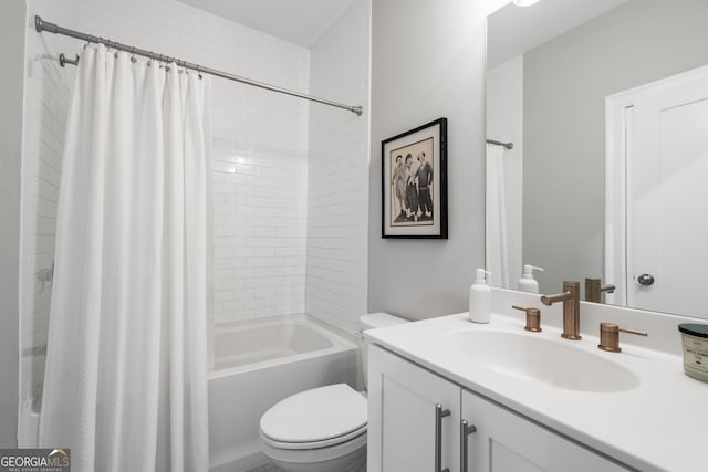 full bathroom with shower / bath combo, vanity, and toilet